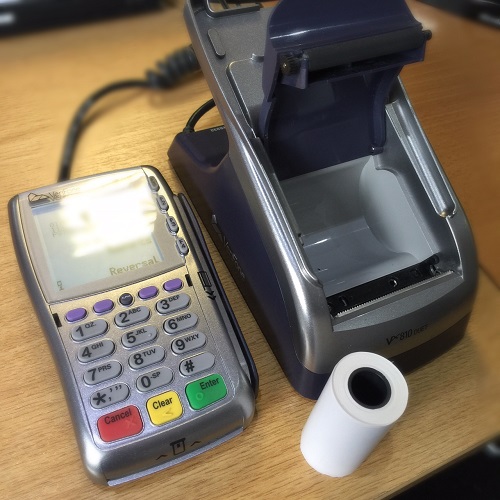 Credit Card Machine with platen arm open ready for new paper roll