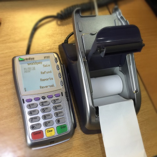 Credit Card machine with paper roll simply dropped into place.